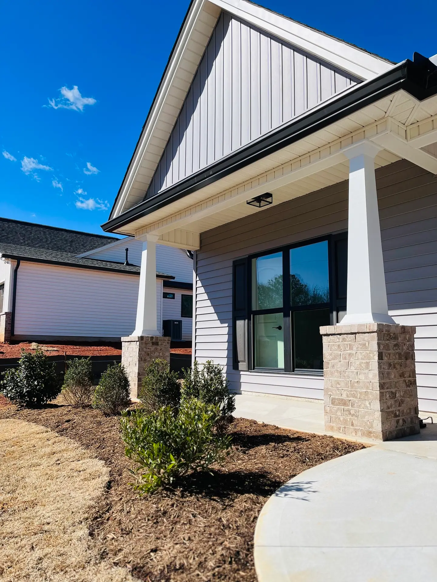 Front of farmhouse-style spec homes - Palmetto Farms in Pelzer, SC.