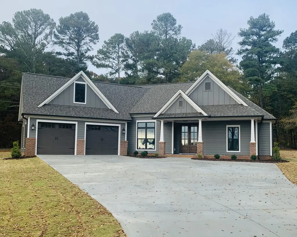 Front of beautiful, modern, one-story home with two-car garage.
